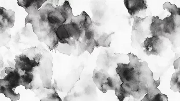 Elegant black and white watercolor wallpaper for desktop featuring abstract ink splashes.