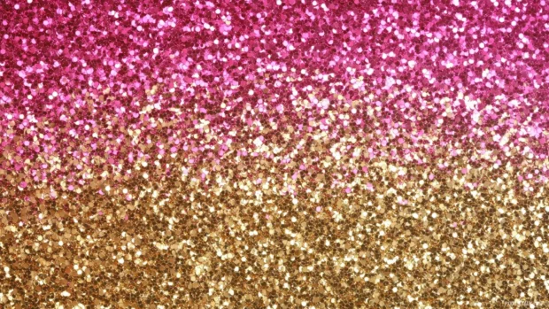 Elegant gold and pink glitter background with soft lighting.