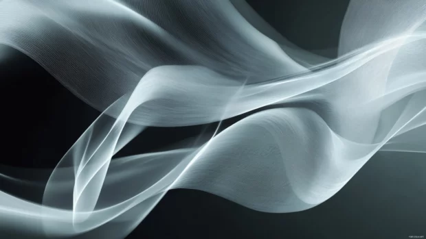 Energetic moving desktop wallpaper showing geometric shapes spinning in motion.