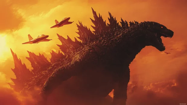 Fighter jets weave around Godzilla in a vivid orange dusk.