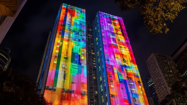 Flashing neon posters covering skyscraper facades.