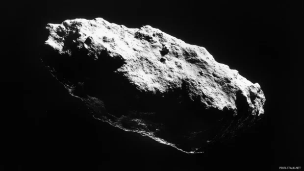 Frozen asteroid drifting in deep space shadows.
