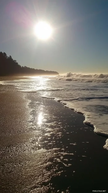 Gentle Pretty Ocean surf caressing sunlit beach.