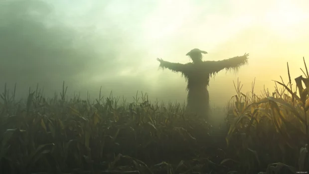 Halloween Desktop Wallpapers featuring creepy scarecrow in foggy cornfield.