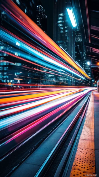 High energy Moving Wallpapers for Android with abstract light trails streaking past.