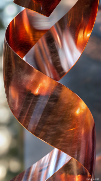 Invisible wind patterns bending sleek metallic ribbons.
