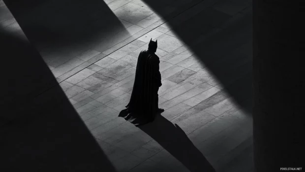 Minimalist Batman logo in shadows, trending among Batman aesthetic wallpapers.