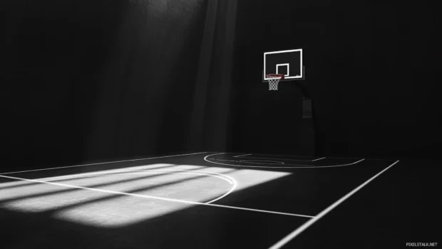 Minimalistic all black basketball court with glowing lines and shadows.