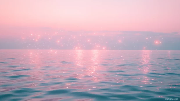 Misty oceans lit by floating star clusters, framing the beauty of pastel starry sky aesthetic wallpaper.