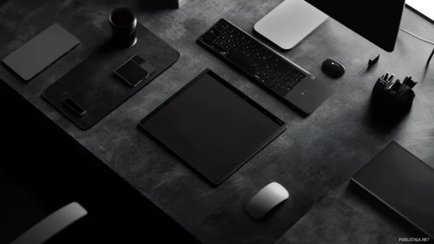 Monochrome gray Desktop Lock screen with subtle texture details.