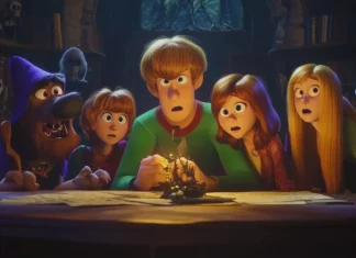 Mystery Inc  solving a spooky mystery, ghosts and ghouls in the background, Cartoon Network logo displayed.