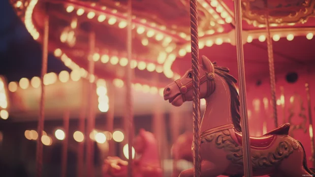Pink Girly carousel spinning softly under fairy lights.