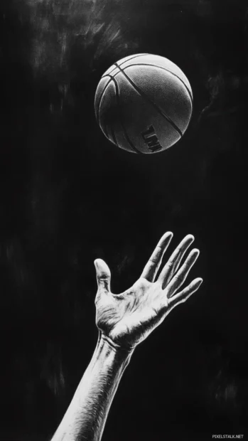 Players hand reaching up for a block as basketball hangs in tensis.