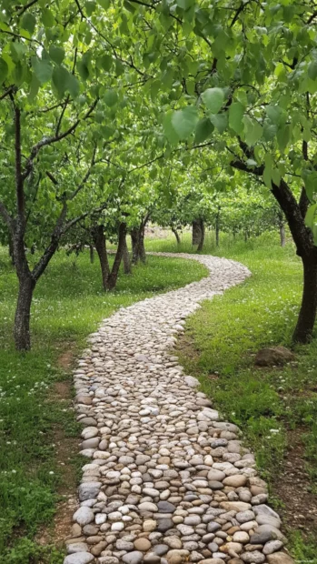 Pretty pebbled path winding through orchard.