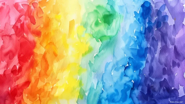 Rainbow watercolor background with a spectrum of colors .