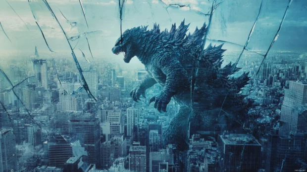 Reflection of Godzilla in broken glass skyscrapers across city.