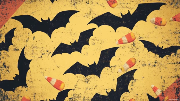 Retro Halloween wallpaper for desktop with bats, candy corn, and nostalgic textures.