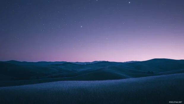 Rolling hills swallowing whispers of stars.