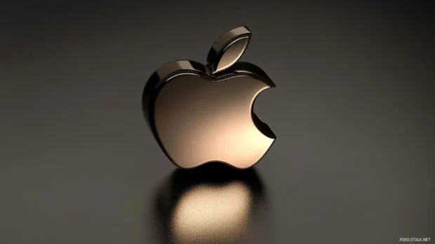 Shiny Apple logo on dark minimalist background with subtle gradient.