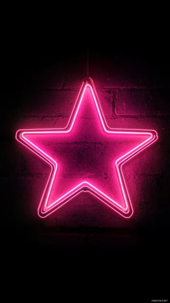 Single pink neon star glowing in endless black.