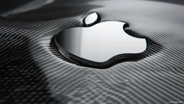 Smooth Apple logo embossed on carbon fiber texture background.