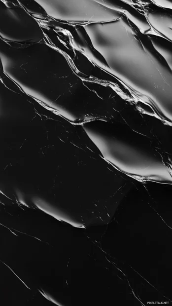 Smooth black marble with faint white veins and subtle glow.