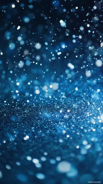 Snowfall sparkling under blue stars.
