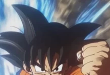 Son Goku blocks a powerful strike with one forearm and does not flinch.