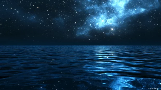 Stars reflected in calm ocean waters, beautifully captured for Galaxy stars background.