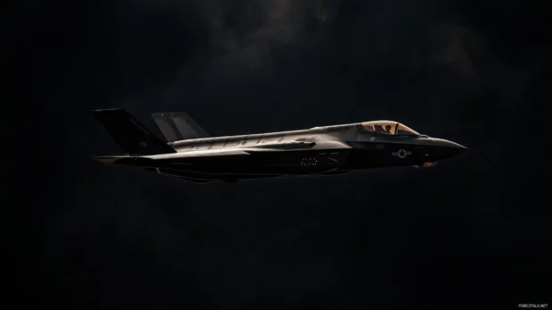 Stealth aircraft against black sky.