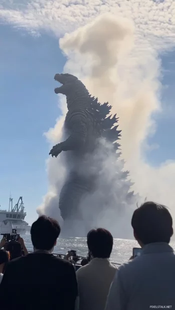 Steam blasts upward as Godzilla lands with immense force.