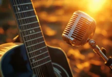 Sunset glow reflecting off steel string guitar, Vintage microphone country wallpaper.