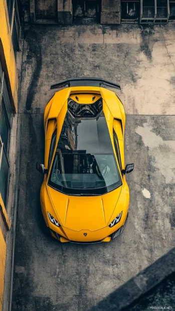 Top down view Lamborghini iPhone Wallpapers with a yellow Sian parked beside a rooftop helipad.