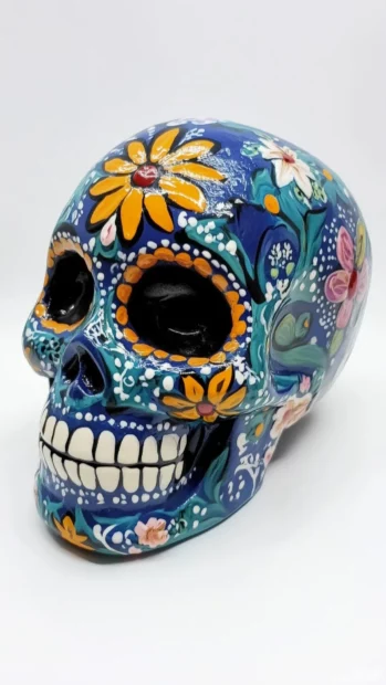 Traditional sugar skull, vibrant colors, intricate floral designs, Dia de los Muertos style.