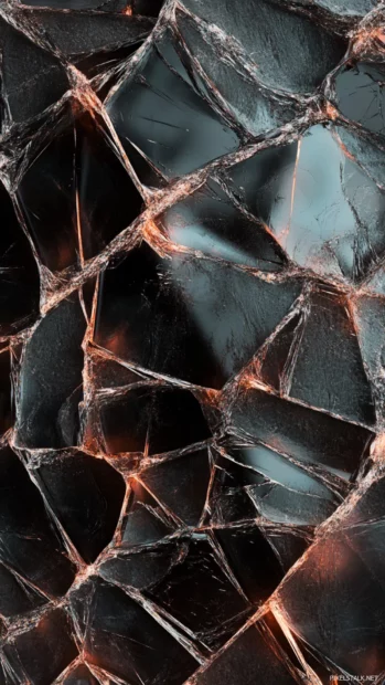 Unique cracked iPhone display with artistic break patterns.