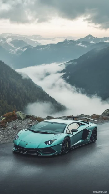 Vertical Lamborghini photo with mountains and fog in background.