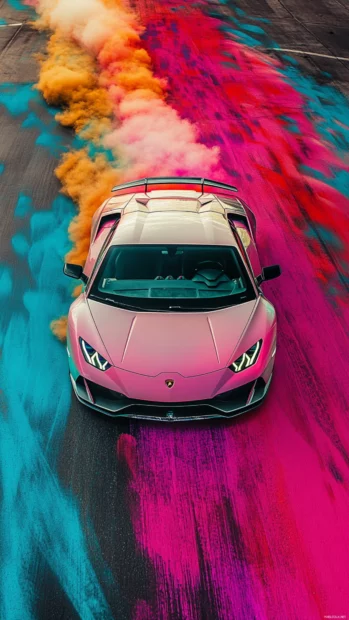 Vertical shot of a Lamborghini drifting across colorful painted asphalt.