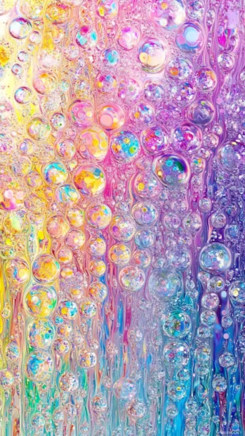 Whimsical Moving iPhone Wallpapers of floating bubbles reflecting rainbow patterns.