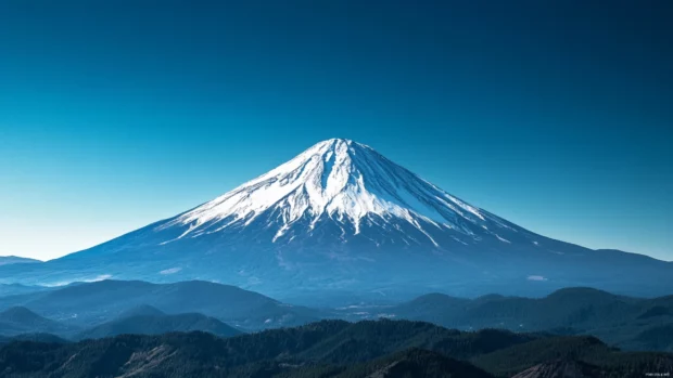 Windows 10 lock screen wallpaper 4K presenting a snowy mountain peak under a clear blue sky.