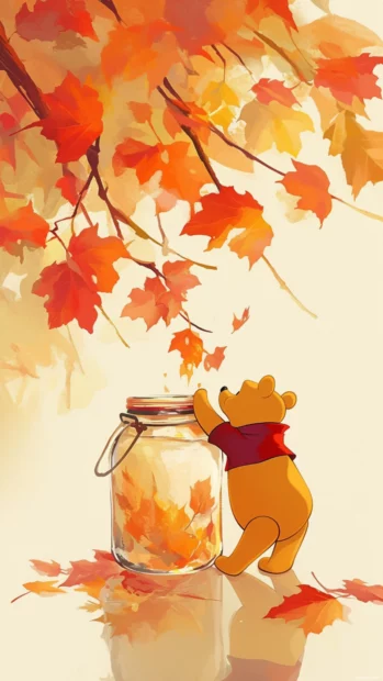 Winnie the Pooh reaching into a honey jar beside autumn leaves.