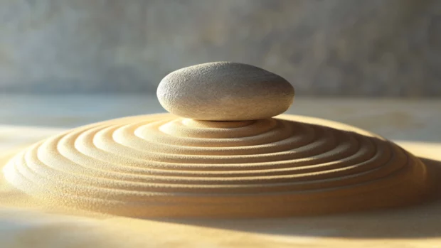 Zen rock garden with concentric sand patterns.