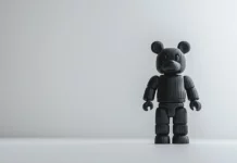 A Bearbrick wallpaper featuring a classic Bearbrick figure standing alone on a white minimalist background.