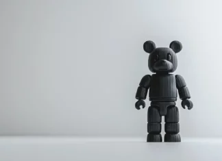 A Bearbrick wallpaper featuring a classic Bearbrick figure standing alone on a white minimalist background.