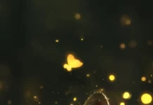 A baby fox nestled in moss with glowing fireflies dancing around, perfect for a cute fox wallpaper.