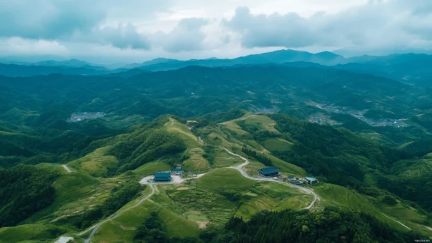 A captivating aerial view of Japans rolling hills and mountain ranges under a pastel sky.