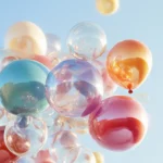 A charming birthday iPhone wallpaper featuring a group of balloons in various shapes and colors against a clear sky.