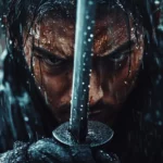 A close up of a determined Japanese samurai gripping his sword with rain falling heavily.