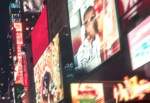 A dynamic Porsche close up as it speeds past glowing city billboards in an anime world.