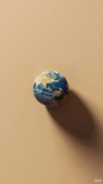 A minimal Earth against a gentle beige background with soft shadows.