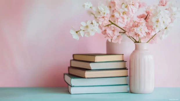 Aesthetic book wallpaper with soft focus and pastel tones, books arranged in a calming composition.